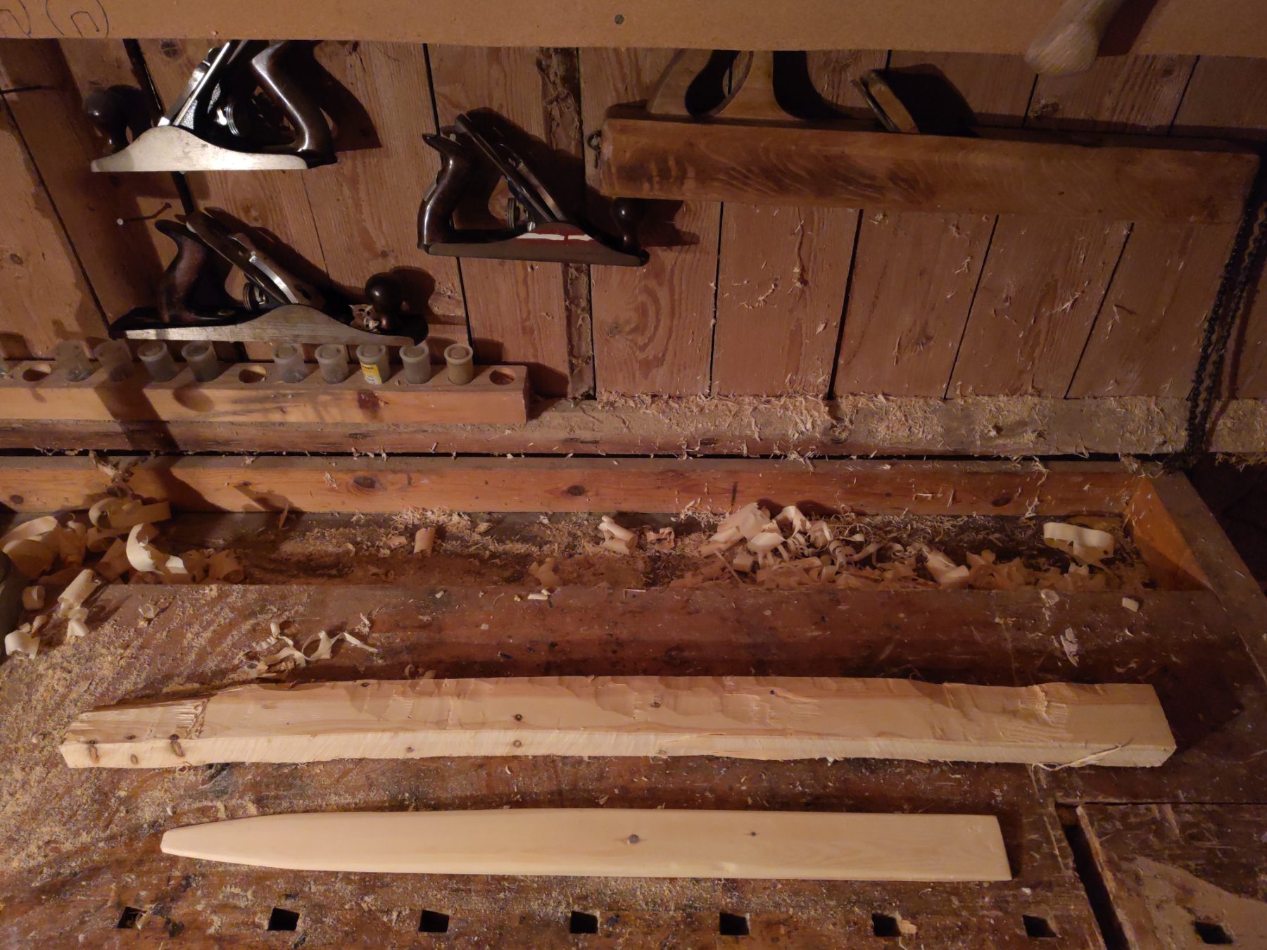 One shaped and one unshaped ski.