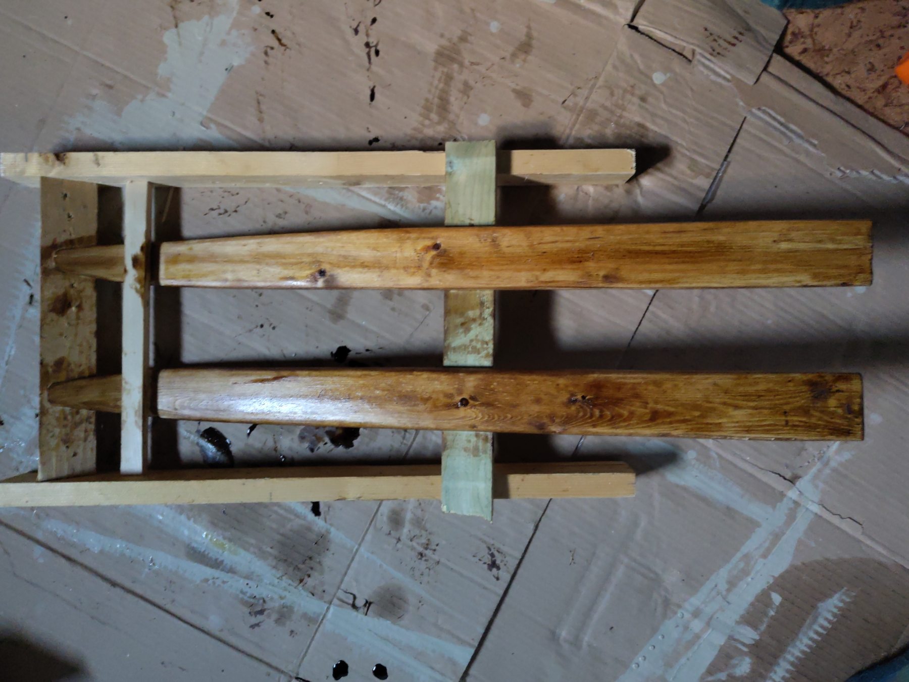 The skis are covered with tar to make them water resistant.