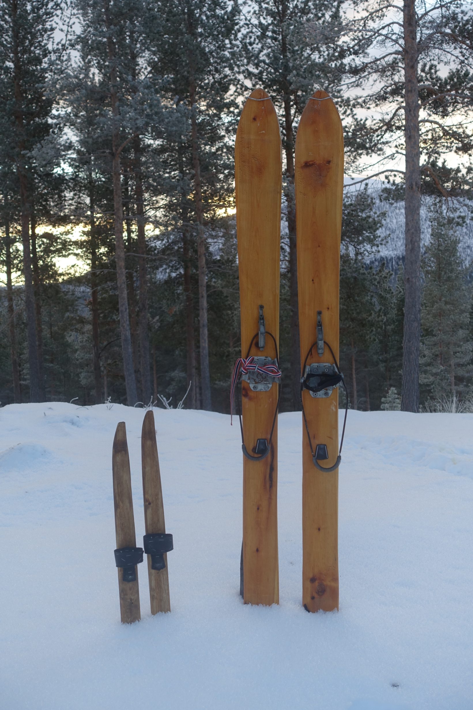 Two generations of wooden skis.